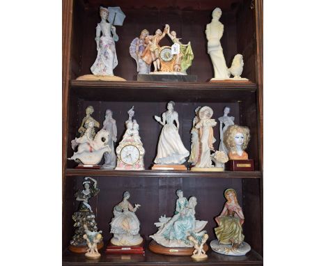 A quantity of cast resin, ceramic and other figures, of ladies in elegant costume; a similar mantel clock, dancing couple; et