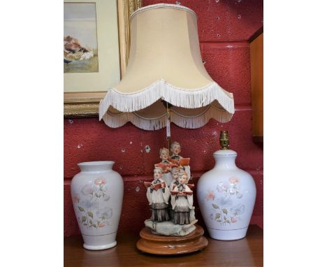 A Guiseppe Armani lamp base, choir boys singing; a Denby Coloroll lamp base; a similar vase (3)