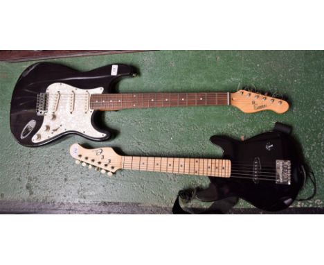 An Encore Stratocaster type electric guitar in gloss black finish with mother-of-pearl effect pickguard, length of guitar 98.
