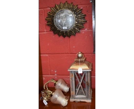 A brass wall lamp bracket; an outdoor lantern; a starburst clock (3)