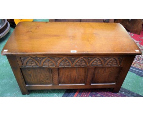 An oak blanket chest, hinged rectangular top above a three panel front, 91.5cm wide