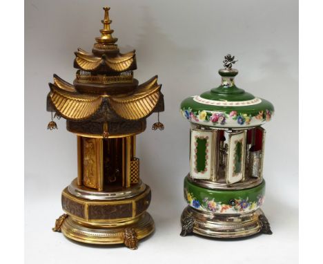 A ceramic and plated metal Reuge Swiss Musical Movement mechanical cigarette/lipstick dispensing carousel, decorated with flo