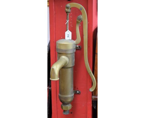 A 20th century brass manual lift stirrup water pump, shaped lever, brass spout