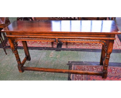 An oak console/side table, slightly oversailing rectangular top above a deep frieze, ring turned supports, rectangular back l