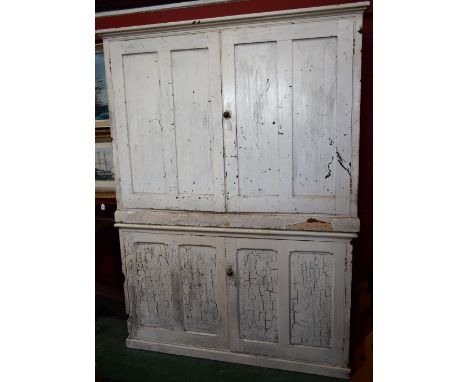 A 20th century painted industrial type cabinet, outswept cornice above a pair of panel door enclosing two shelves; another si