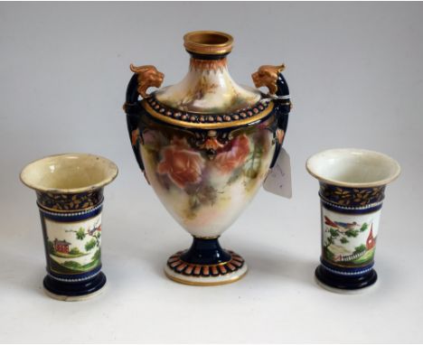 A Hadleys Worcester pedestal ovoid vase, decorated with roses, lion masks flying handles, beaded border, stiff leaves to neck