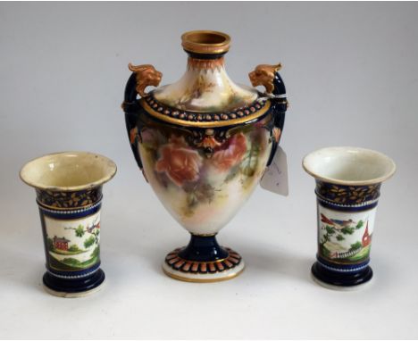 A Hadleys Worcester pedestal ovoid vase, decorated with roses, lion masks flying handles, beaded border, stiff leaves to neck