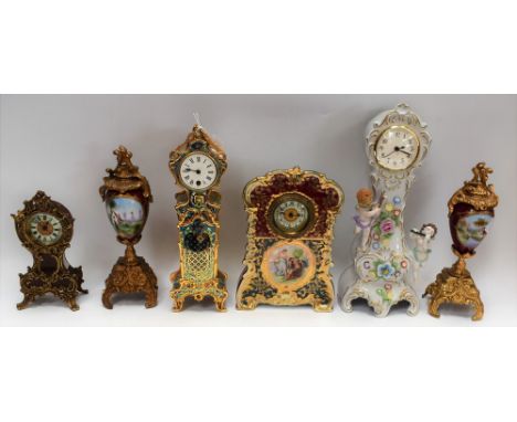 An early 20th Century Noritake mantel clock, central panel depicting courting couple; a champleve style mantel clock, of smal