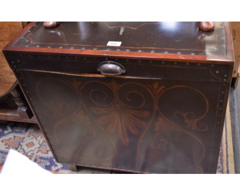 A contemporary trunk/chest, the top and sides inset with sheet metal panels decorated with stylised flowers and foliage,  63.