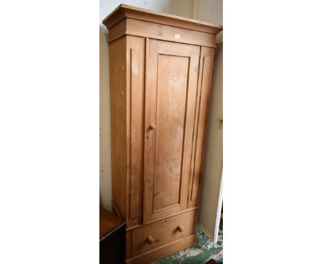 A pine hall robe, outswept cornice above a single panel door and a deep drawer, plinth base, 198.5cm high