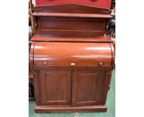 A Victorian cylinder bureau/chiffonier, shaped shelved half gallery above a retractable front enclosing a sliding plateau wit