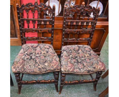 A pair of 17th century style Derbyshire design side chairs, each with a shaped cresting rail applied with scrolling acanthus 