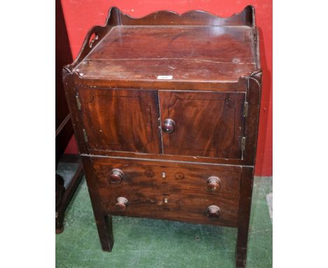 A George III mahogany tray top commode, galleried top above a pair of small cupboard doors and one large drawer incorporating
