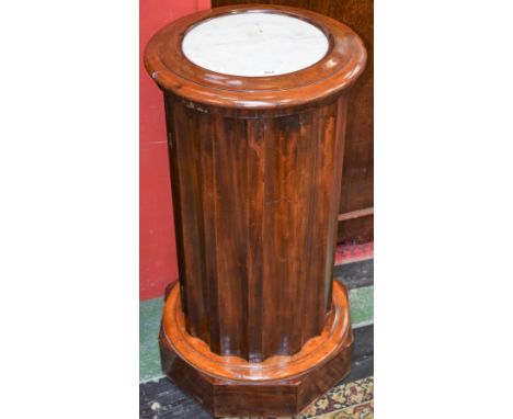 A Victorian mahogany dodecagonal wash/jardiniere stand, circular top with inset marble panel above a cupboard door, stepped c