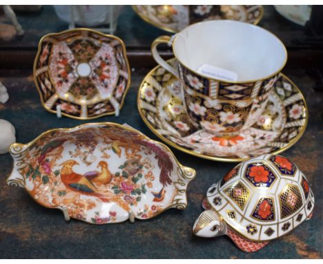 A Royal Crown Derby 2451 pattern trinket dish, first quality; a similar cup and saucer, second quality; an Olde Avesbury patt