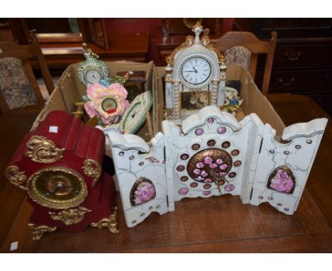 An ornate ceramic mantel clock, decorated with moulded convolvulus flowers, Seth Thomas, Royal Leamington Spa; another simila