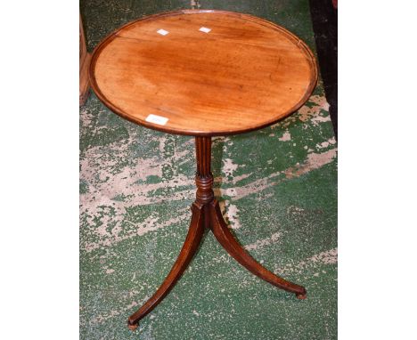 A 19th century mahogany occasional table, dished circular top, reeded and ring turned column, triform base, bun feet, 70cm hi