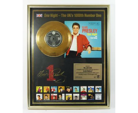 A mounted gold vinyl, Elvis Presley, One Night and I Got Stung, commemorating One Night being the 1000th single to hit number