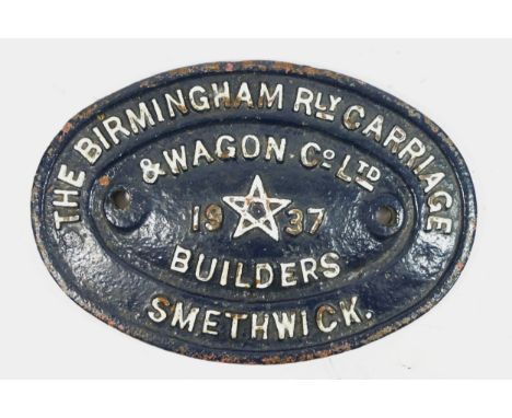 An oval cast iron railway wagon builders plate, 'The Birmingham Rly. Carriage &amp; Wagon Co Ltd', Smethwick 1937. 24 x 17cm.