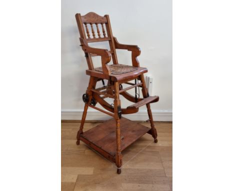 An Edwardian beech child's metamorphic high chair, converting to a rocking chair or a desk with abacus, lacking drop down tra