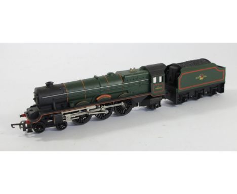 A Tri-Ang OO gauge, loco with tender, 46201 'Princess Elizabeth' in BR livery, together with three Tri-Ang OO gauge wagons to