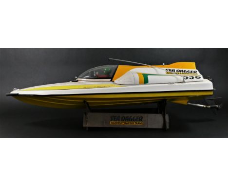 Academy Sea Dagger, c.2000, a radio controlled speed boat, single screw out board motor, stand, 80 x 25cm 