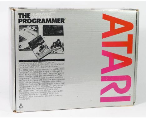 An Atari 400 (serial No 050 122858), boxed, two joysticks and two paddle controllers, with manual, paperwork and receipts, al