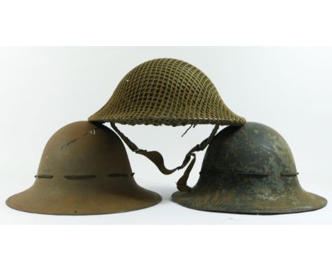 A WWII British Army Brodie helmet, dated 1941 and two WWII Zuckerman helmets, one dated 1941 (3). 