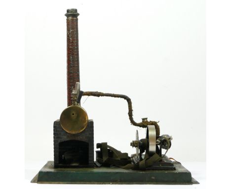 A Doll et Cie vintage tinplate live steam horizontal engine, 24 x 21cm.Doll et Cie (DC), were founded in 1898 by Peter Doll a