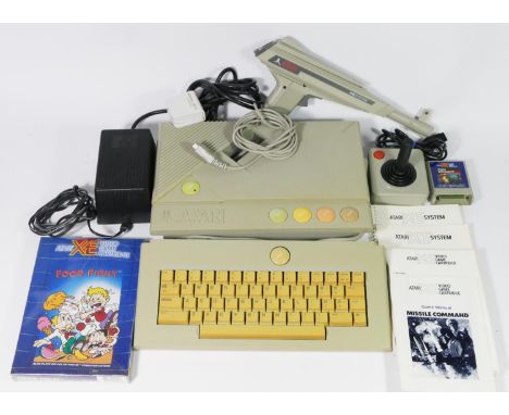 An Atari XEGS system (serial No A1 793005452), with manual, keyboard (serial No R1784 002654), with manual, power supply, joy