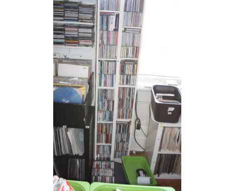 TWO WHITE CD STANDS, 202cm high containing over two hundred and fifty CD's of various music genres and two trays of cassette 