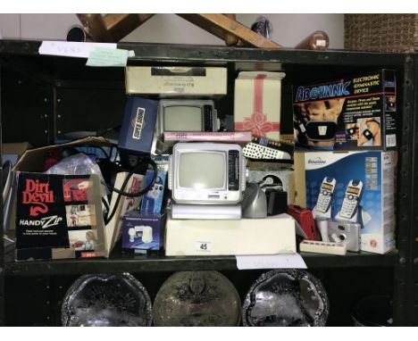 A shelf of boxed electrical items including telephone.