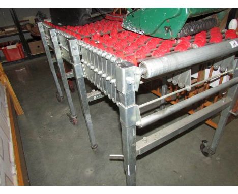 A concertina conveyer roller table.