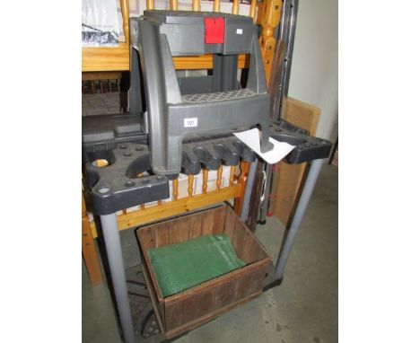 A plastic tool rack, a step tool box, a wooden box and a rechargable screwdriver.