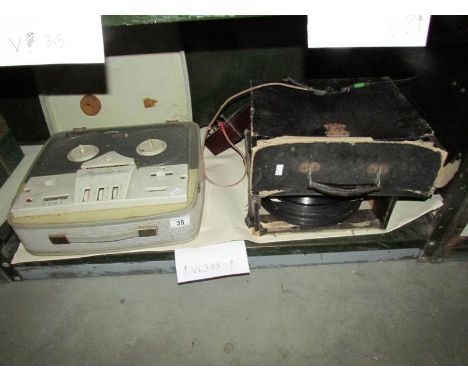 A reel to reel tape recorder and a quantity of 78 rpm records.