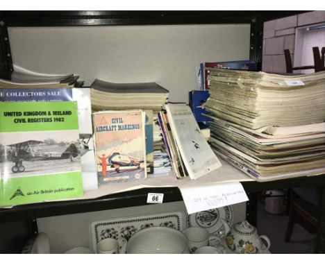 A shelf of dated aviation magazines.