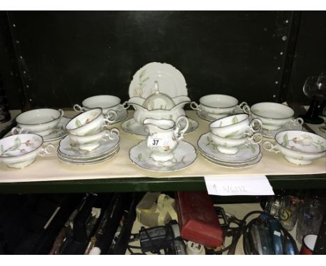 A shelf of German porcelain table ware.