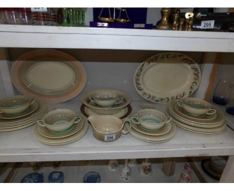 A shelf of Susie Cooper dinner ware etc.,