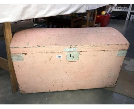 A shabby chic wooden trunk.