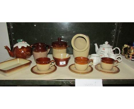 A shelf of stoneware, 3 piece tea set etc.,