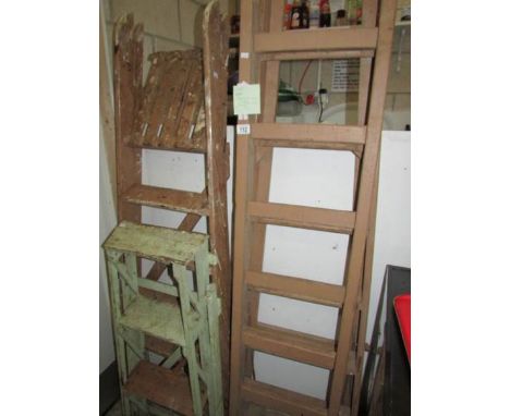 3 painted step ladders and one other.