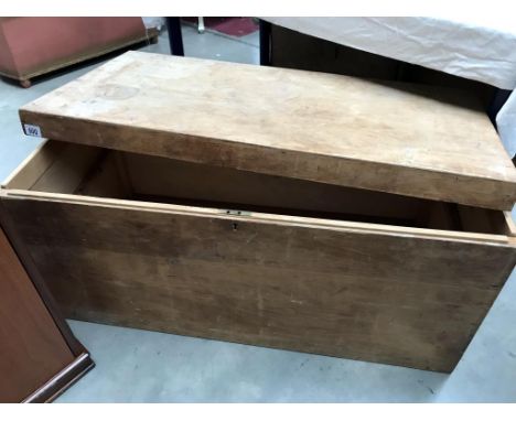 A large wooden trunk, lid a/f.