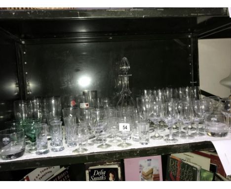 A shelf of glassware,