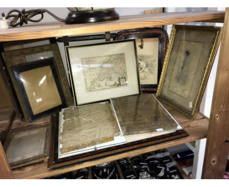 A shelf of framed and glazed maps, pictures, picture frames etc.,