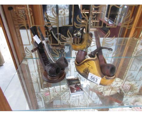 2 pipe stands, pipes and cigarette lighter.