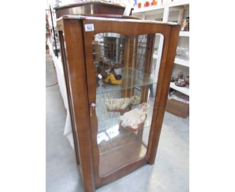 An old china cabinet (missing one side glass panel).