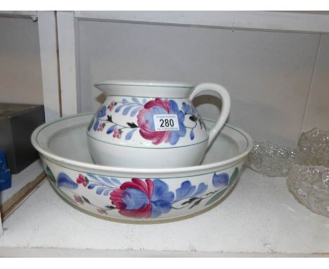 A pottery Adderleys hand painted jug and basin set.
