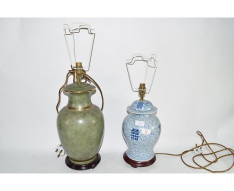 LAMP WITH ORIENTAL BLUE POTTERY DESIGN TOGETHER WITH A GREEN GLAZED POTTERY LAMP (2)