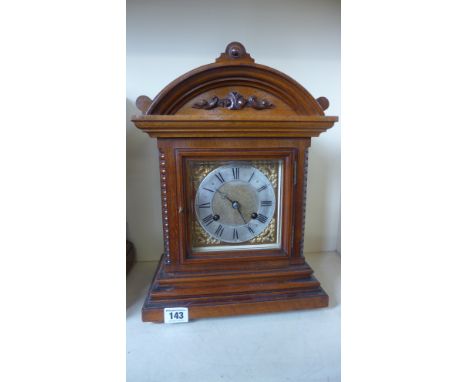 An eight day French walnut case mantel clock brass and silvered dial, strikes on coiled gong - Height 36cm - Working 