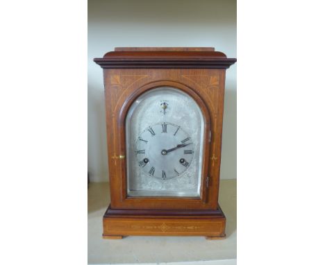 A mahogany inlaid Junghams chiming mantel clock, chiming on four rods with a silver dial - Height 36cm - Working order